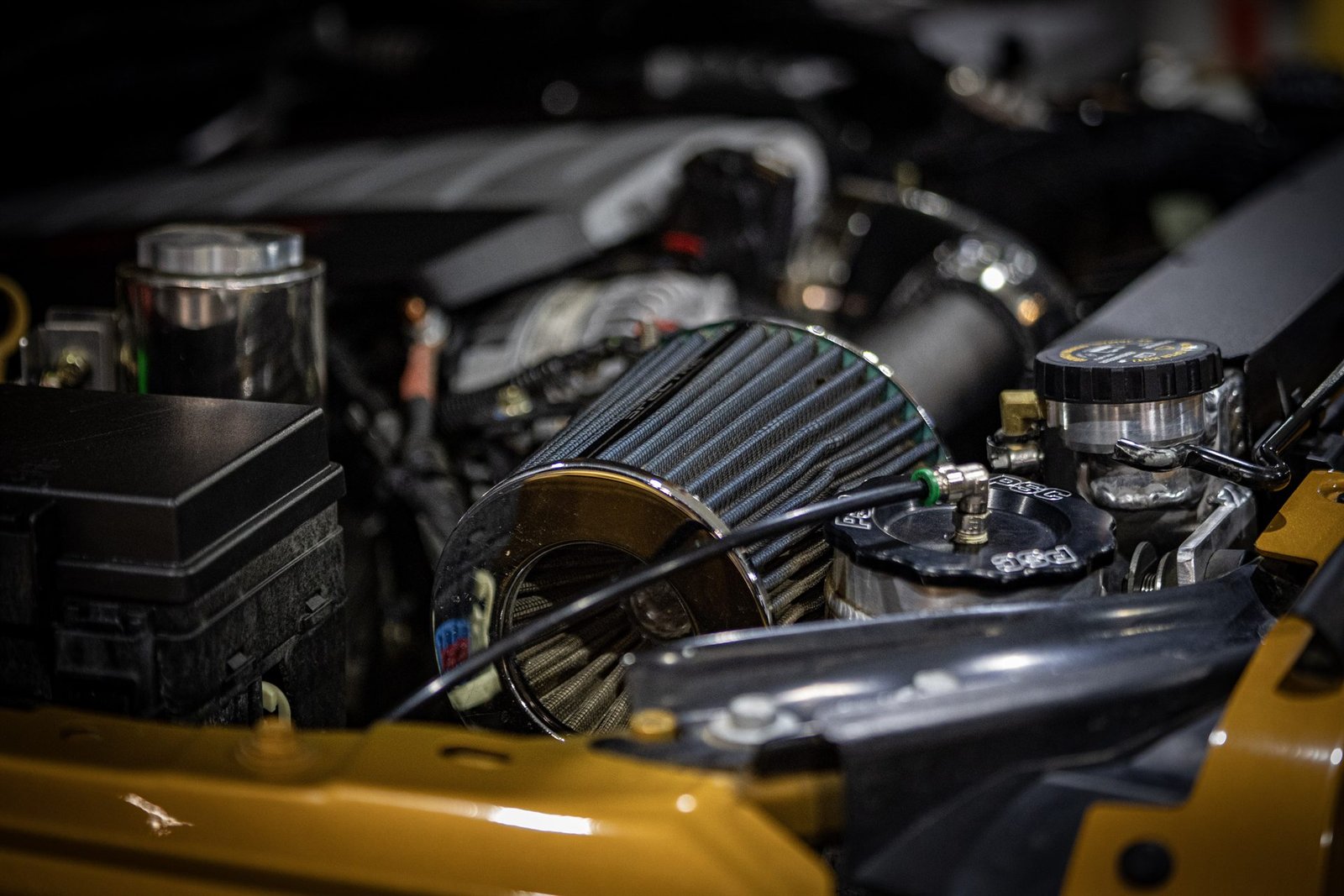 Engine bay with PSC steering reservoir and cold air intake