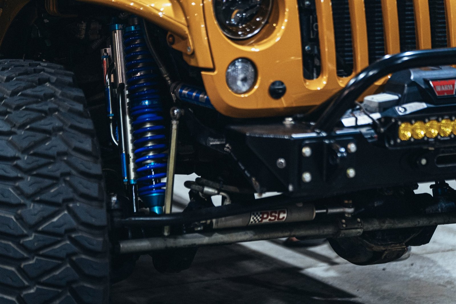 Front suspension with King shocks, PSC steering, and Warn winch