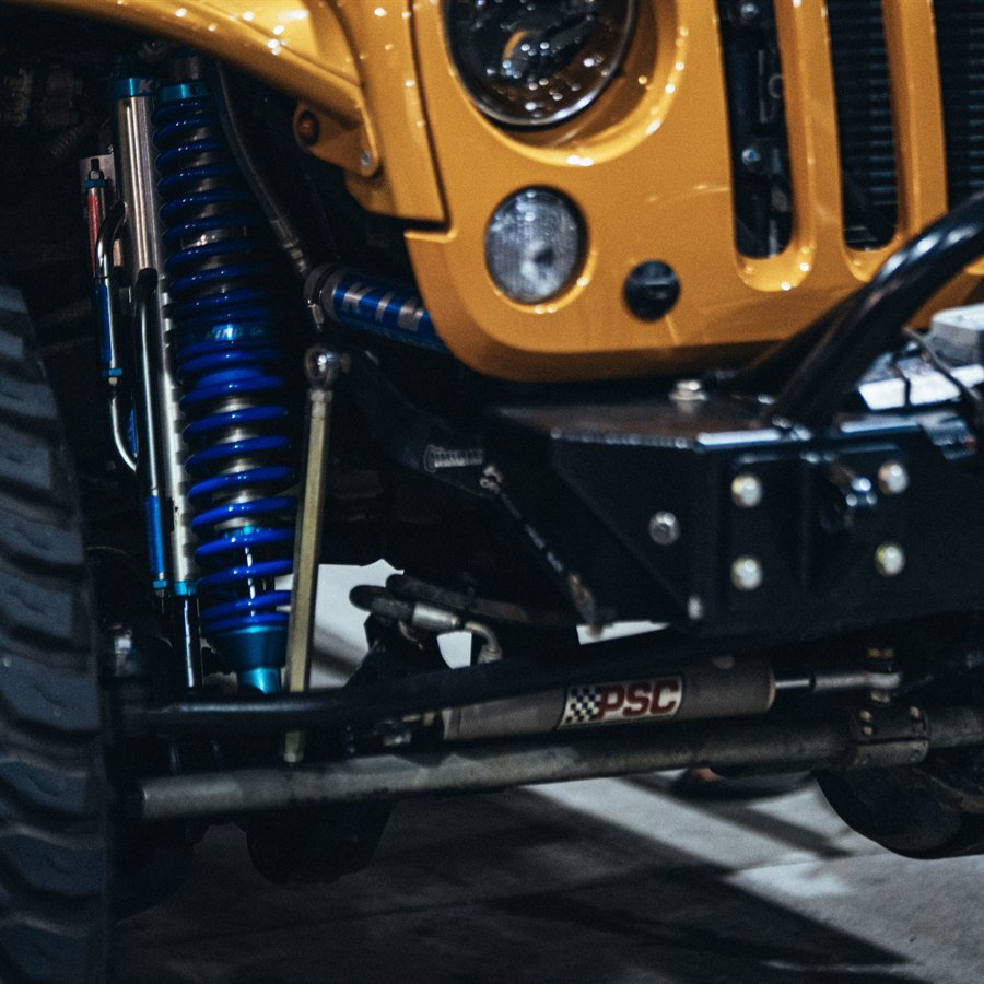 Front suspension with King shocks, PSC steering, and Warn winch